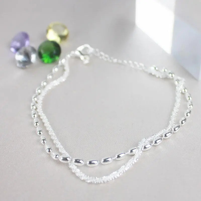 Set van elegante zilveren armbanden met zirconiumstenen