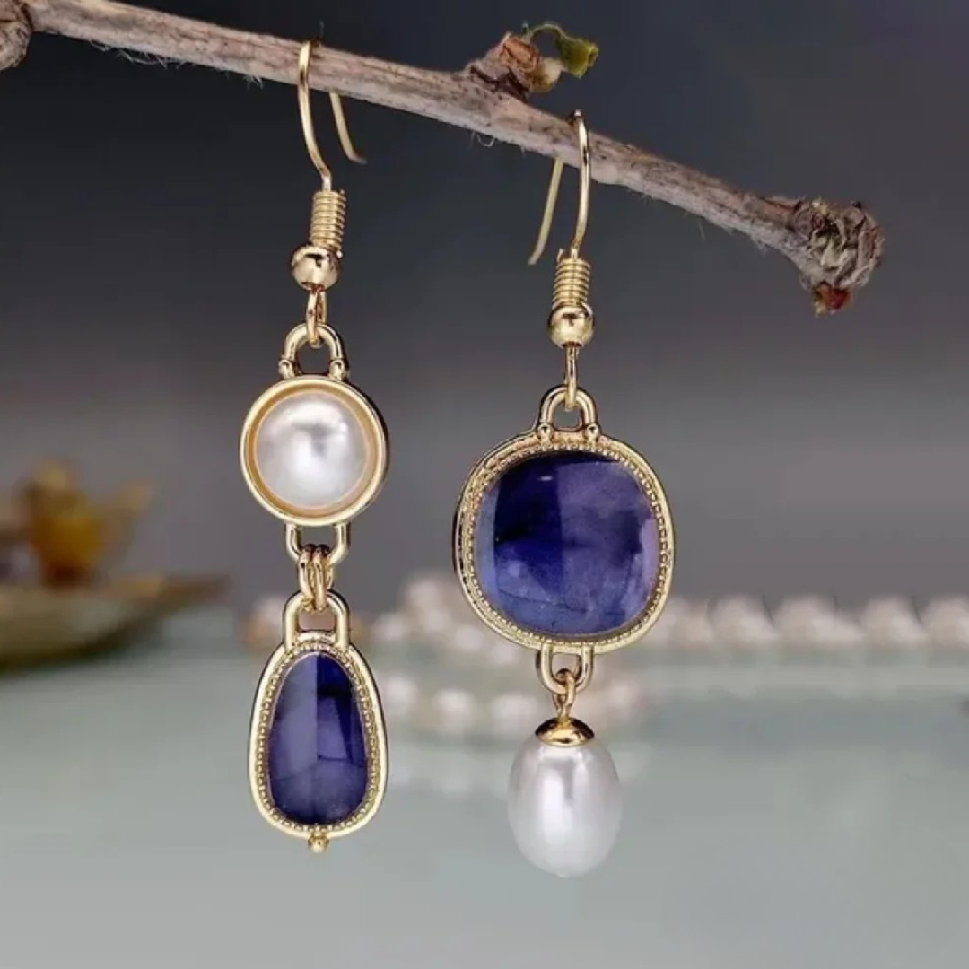 Elegante oorbellen met blauwe steen en parel